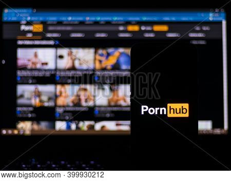 Kathmandu, Nepal - December 17 2020: Smartphone With Pornhub Logo In The Foreground And Pc Computer 