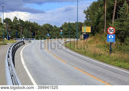 Road And Roundabout In Vestland Region, Norway. 50 Kmh Speed Limit And Speed Camera Warning.