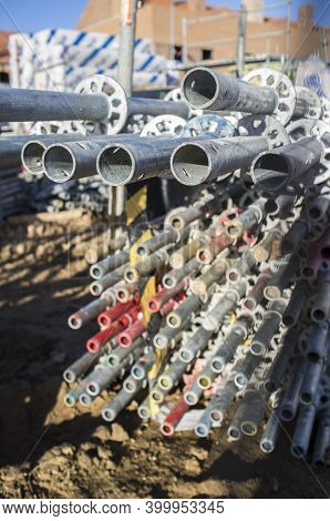 Unmounted Scaffolds Elements Piled At Construction Site. Selective Focus