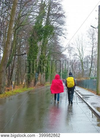 Couple Walking Nordica March Hiking Through A Berlin Park At Germany