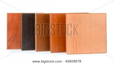 Row of samples of  stained wood for furniture isolated on white