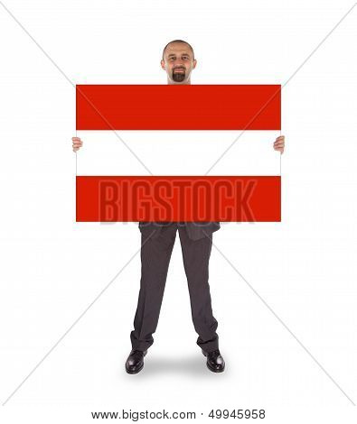Smiling Businessman Holding A Big Card, Flag Of Austria