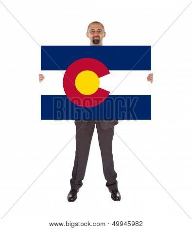 Smiling Businessman Holding A Big Card, Flag Of Colorado