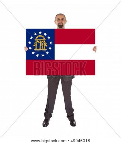 Smiling Businessman Holding A Big Card, Flag Of Georgia
