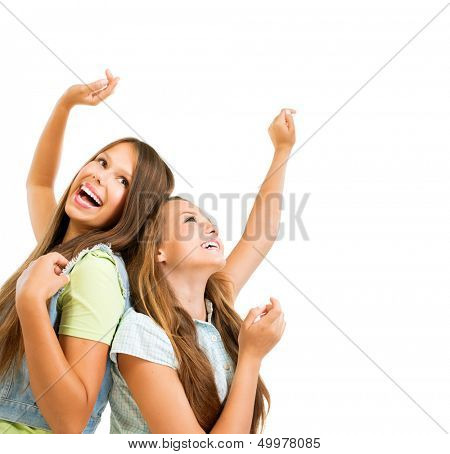 Happy and Laughing Teenage Girls Dancing. Hands up. Beauty Teenagers Having Fun together. Girlfriends