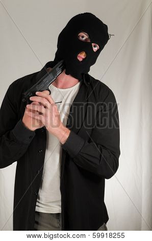 Man Holding a Pistol Gun