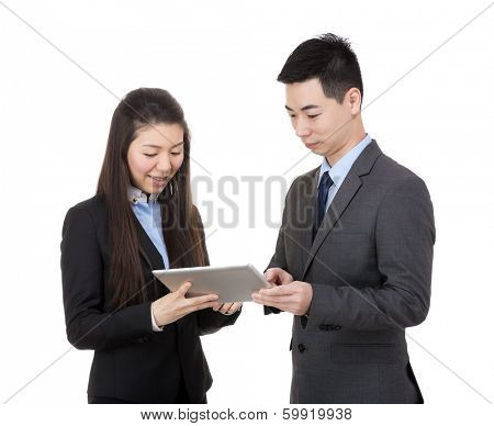 Businesspeople using tablet together
