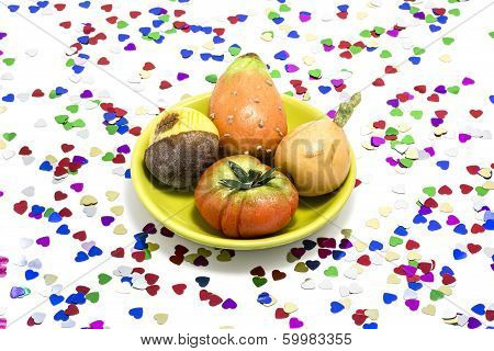Marzipan sweets, surrounded by so many multicolor hearts