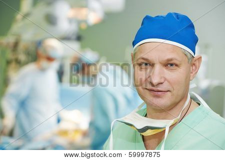 Male surgeon in uniform in front of cardiac surgery operation room at clinic