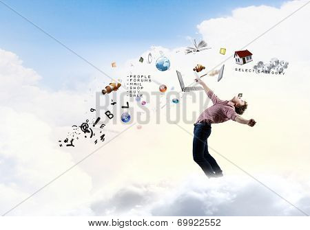 Young man in casual evading from flying icons