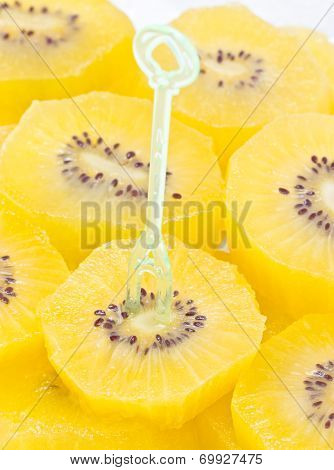 Sliced Kiwi Fruit With Plastic Fork.