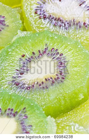 Full Frame Of Green Kiwi Fruit Sliced.
