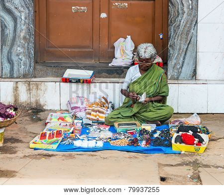 Trichy, India - February 15: An Unidentified Indian Woman Sells Haberdashery Sitting On The Pavement