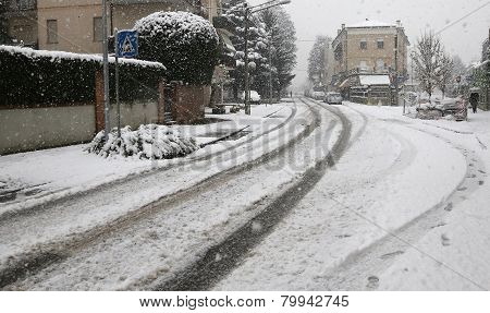 City Street With White Snow During A Winter Snowfall