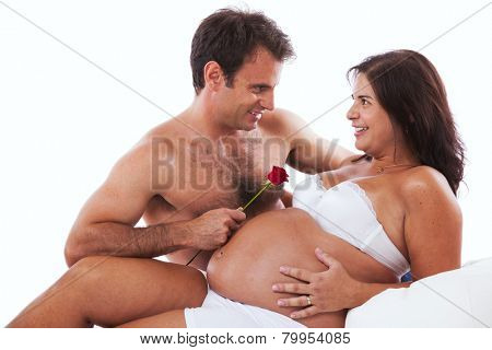 Husband embrassing his pregnant wife