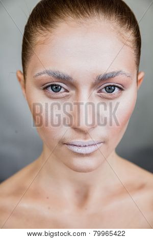 Beautiful Young Woman With Professional Nude Makeup. Fashion Image With Professional Cosmetics. Neat