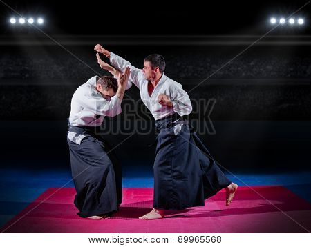 Fight between two aikido fighters at sport hall