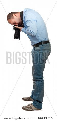 portrait of photografer point camera on his feet