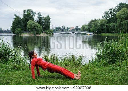 Beautiful Young Woman Performing Yoga Exercises