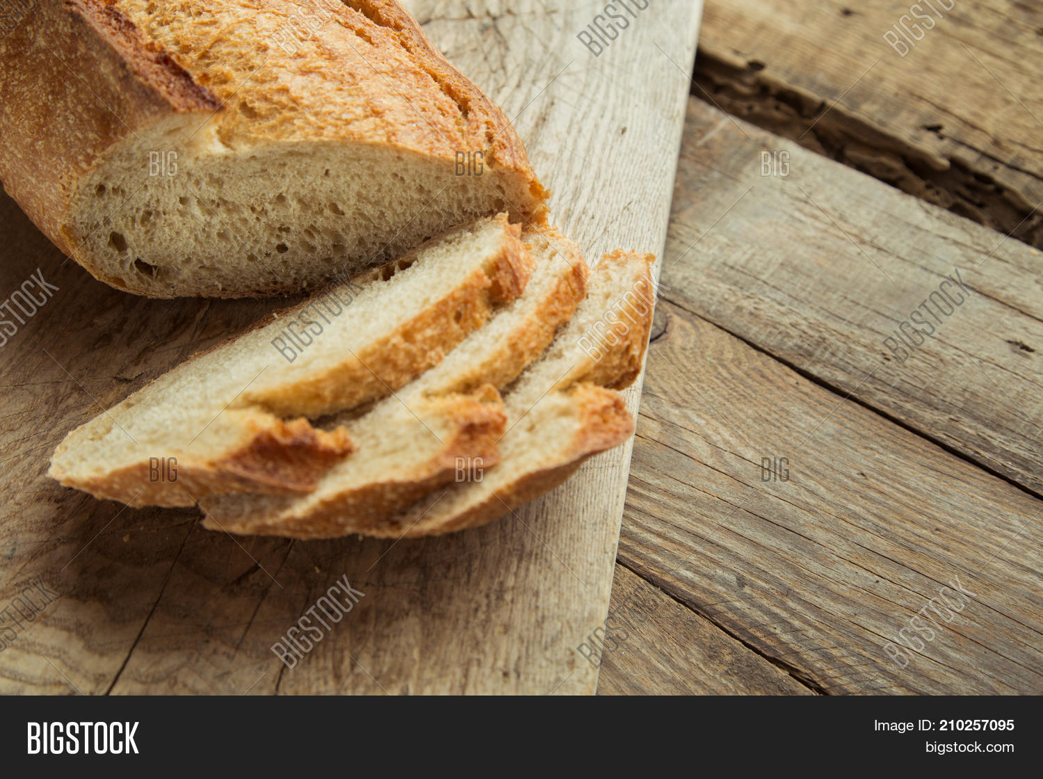 top view of sliced wholegrain bread on a wooden table.