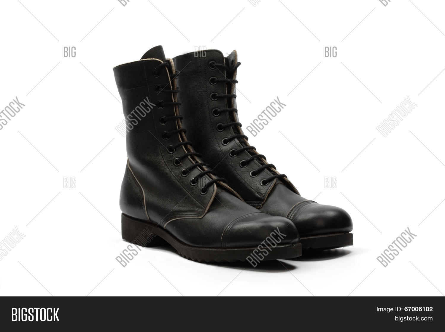 black leather combat boots isolated over white