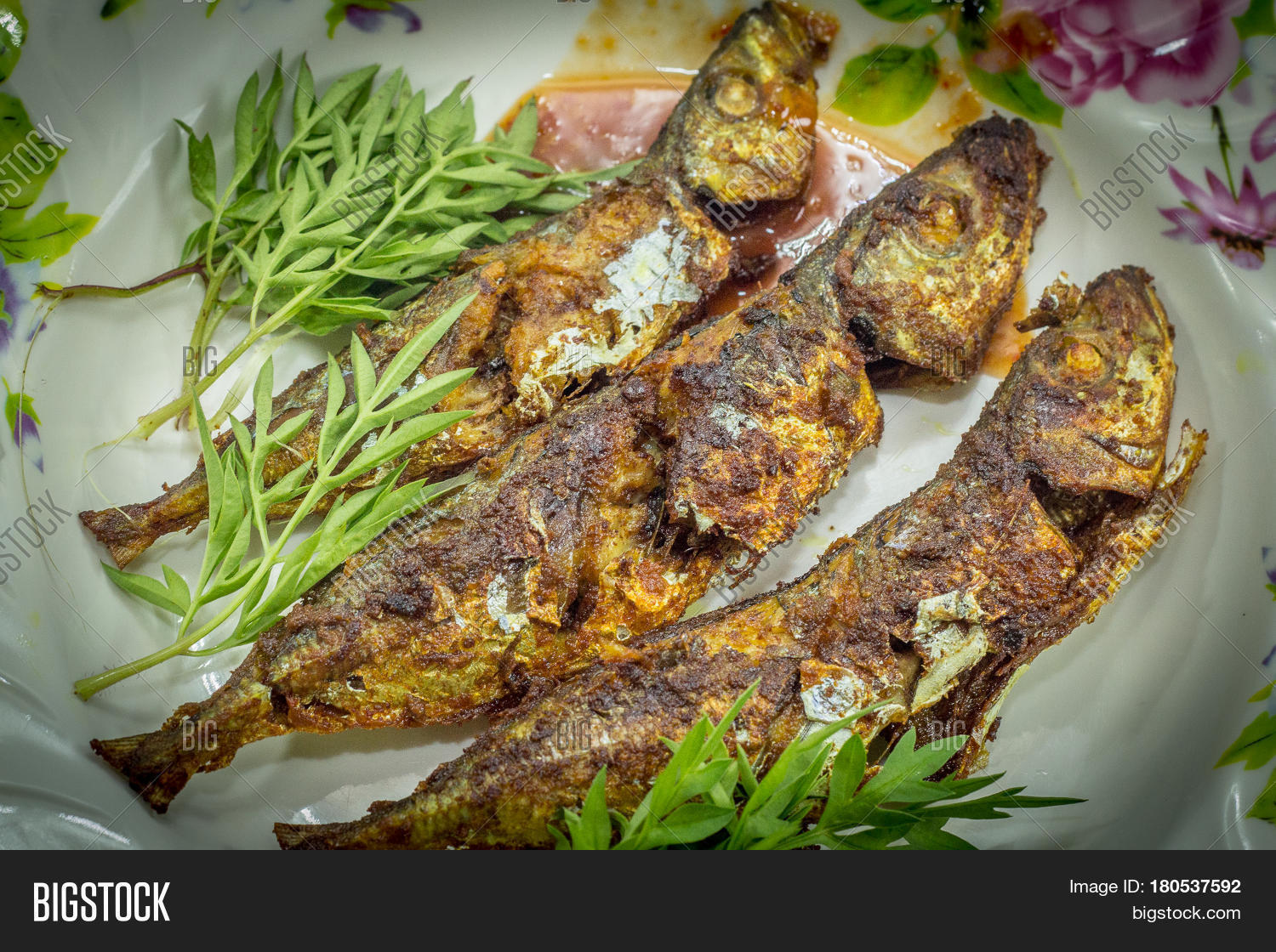 fried fish with sambal is a popular home-style dish in malaysia