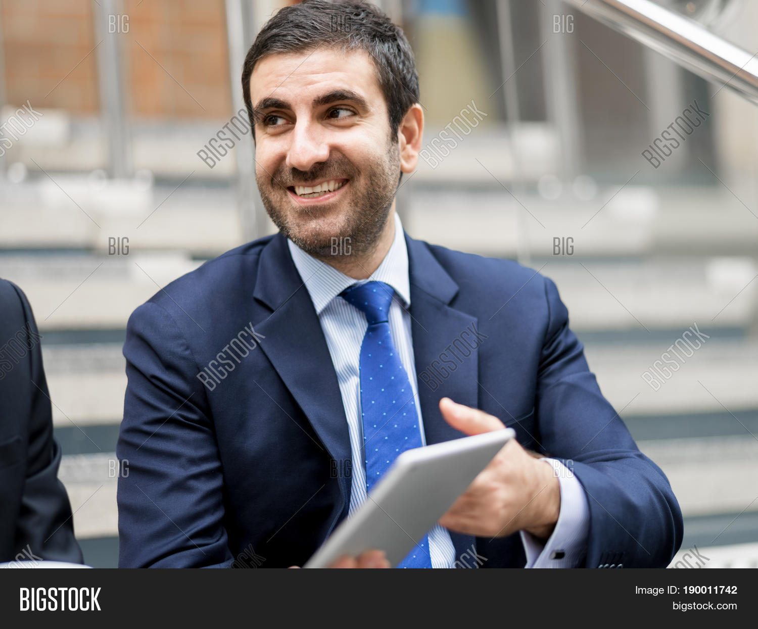 two businessmen talking outdoors