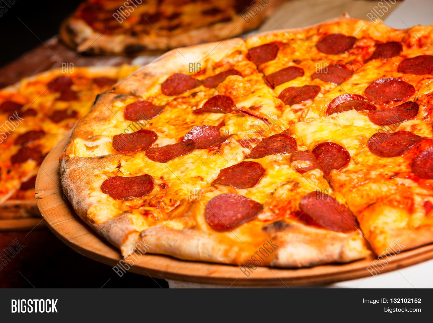 fresh original italian pizza on a wooden board in italian