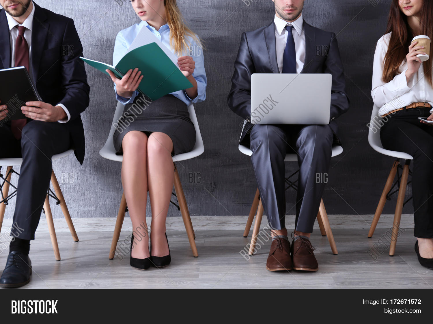 group of young people waiting for interview indoors