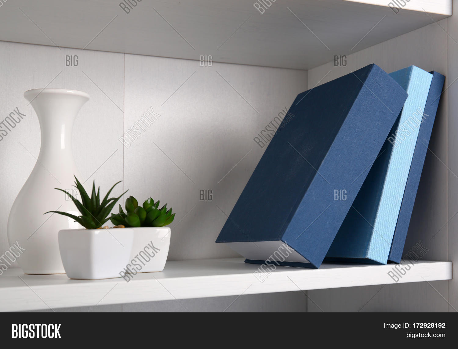 white wooden shelving with books