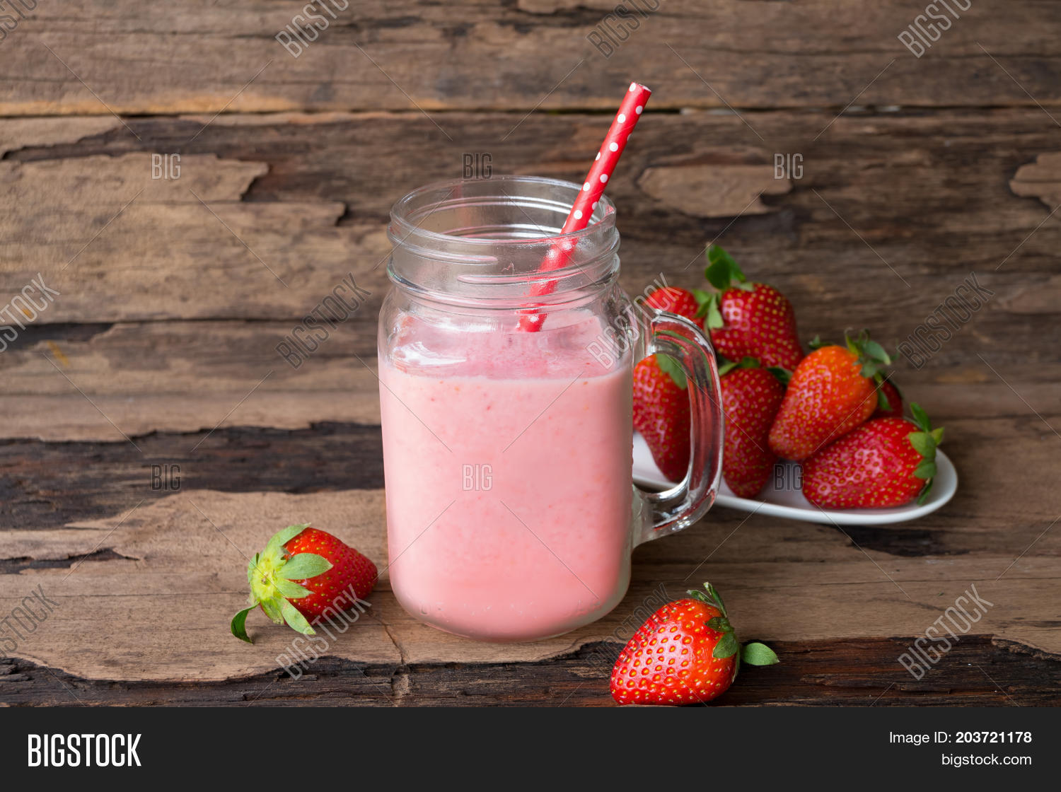 smoothies strawberry yogurt on old wooden floor.