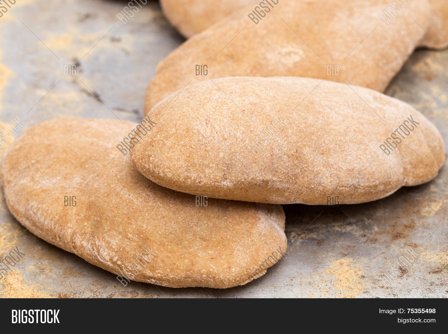 loaves of traditional egyptian homemade brown pita bread, fresh
