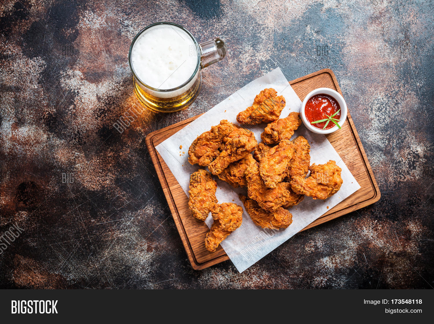 buffalo style chicken wings served with cold beer, top view with