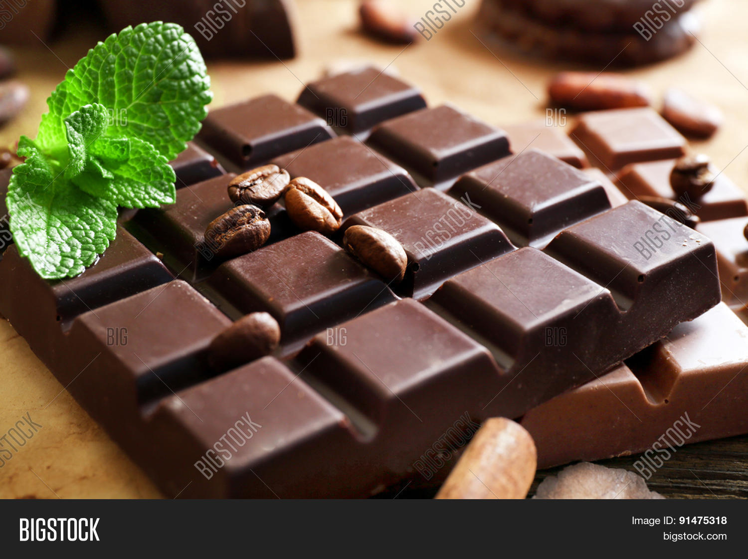chocolate with mint, spices and coffee beans on table, closeup