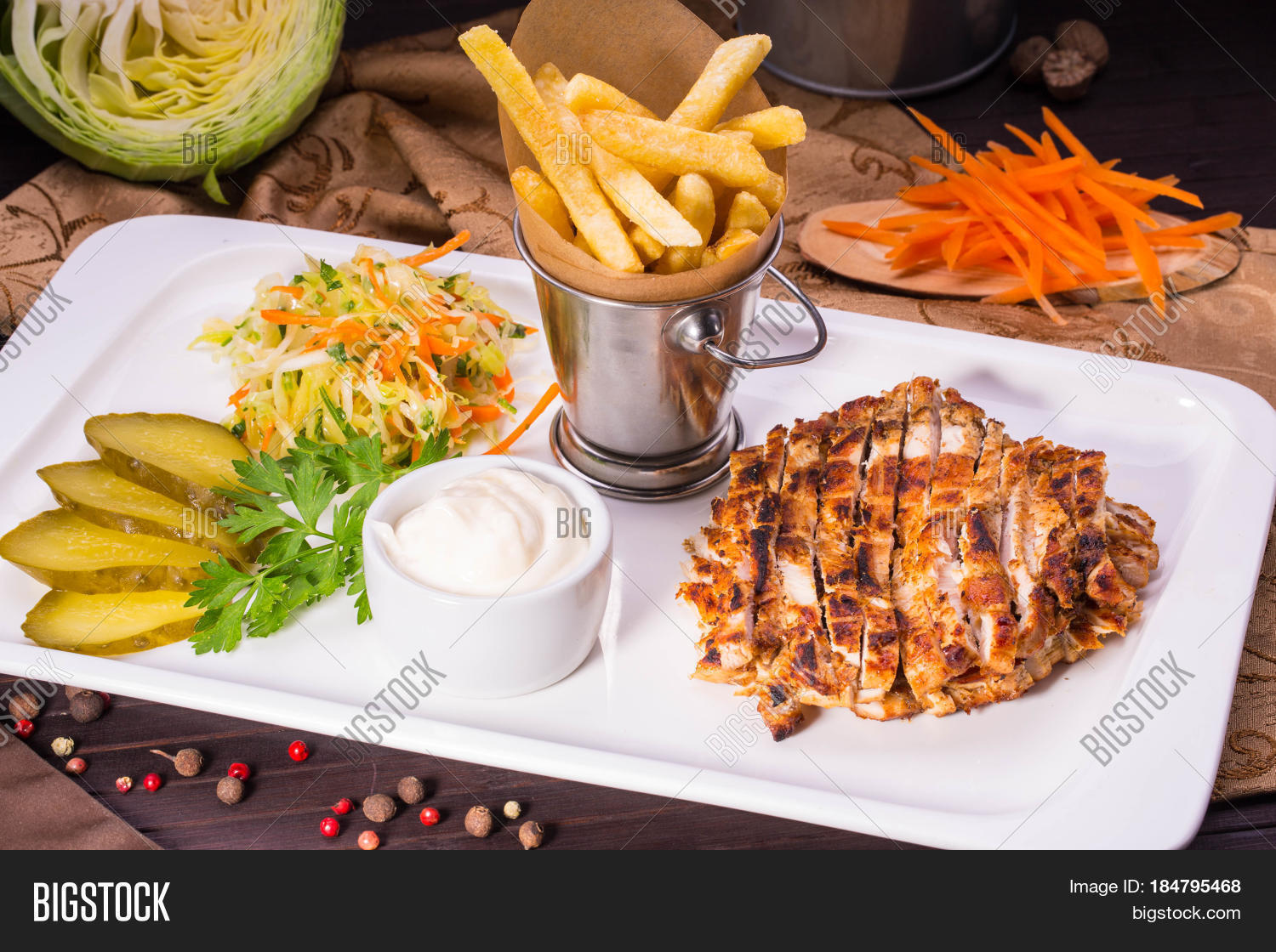 marinated slices of the fried meat, are served with french fries