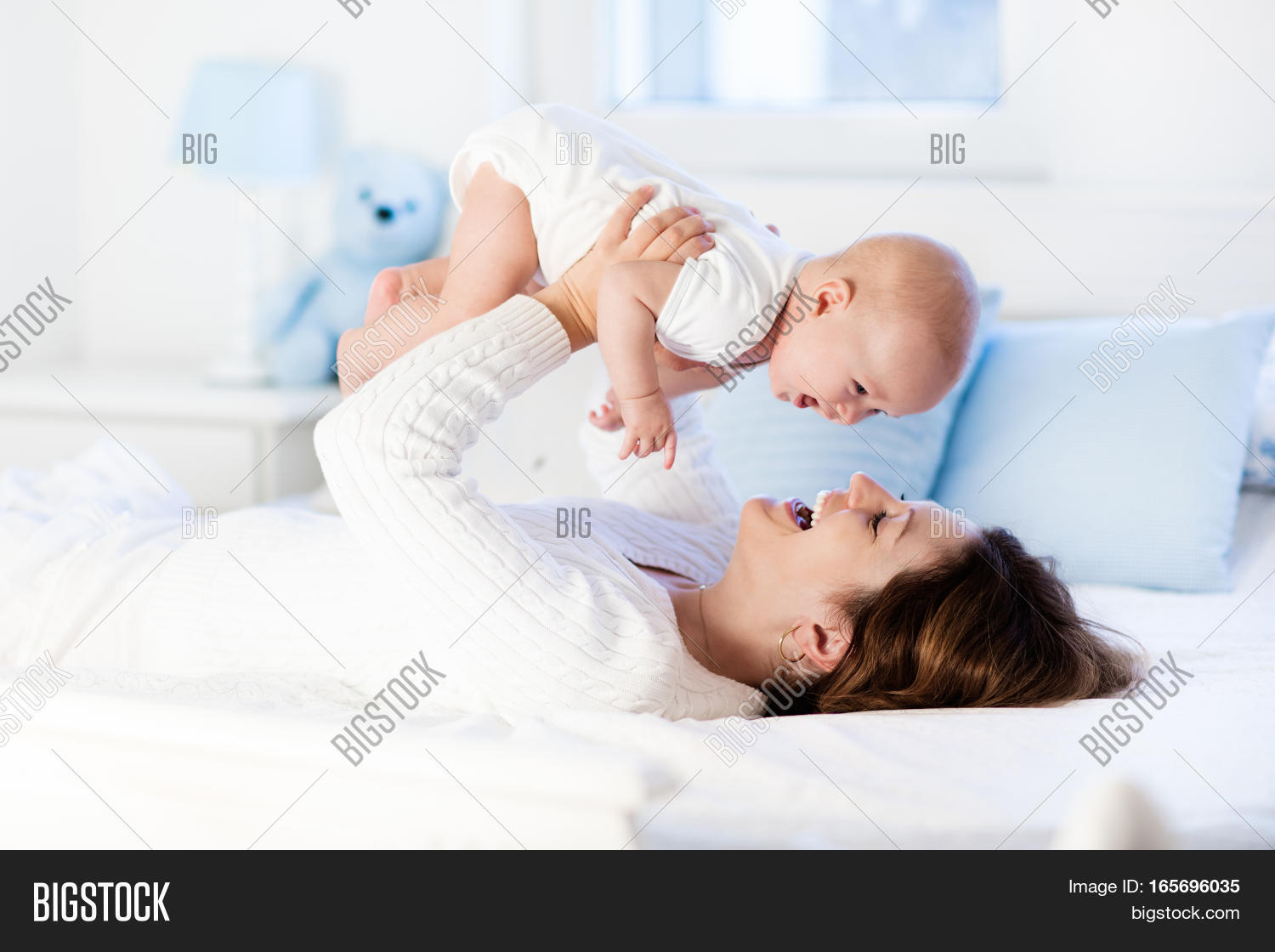 baby and mother at home. mom and child.