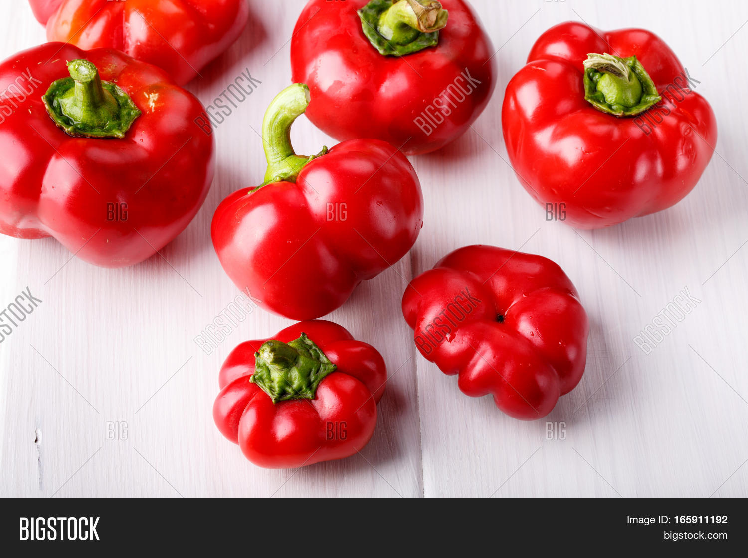 tomato shaped sweet pepper on white.