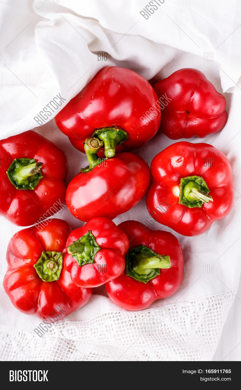 tomato shaped sweet pepper on white.