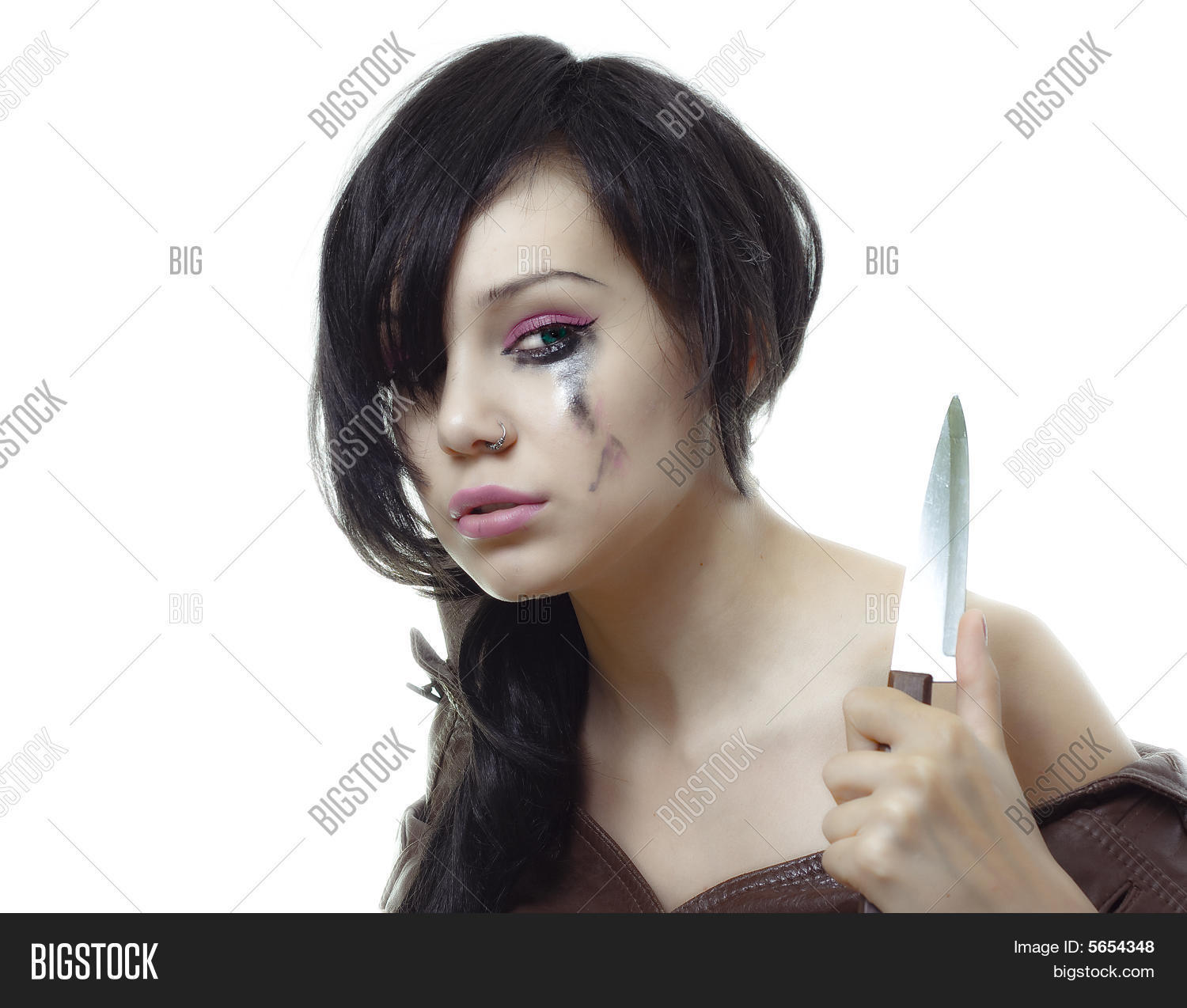 beauty young crying woman with khife in her hand