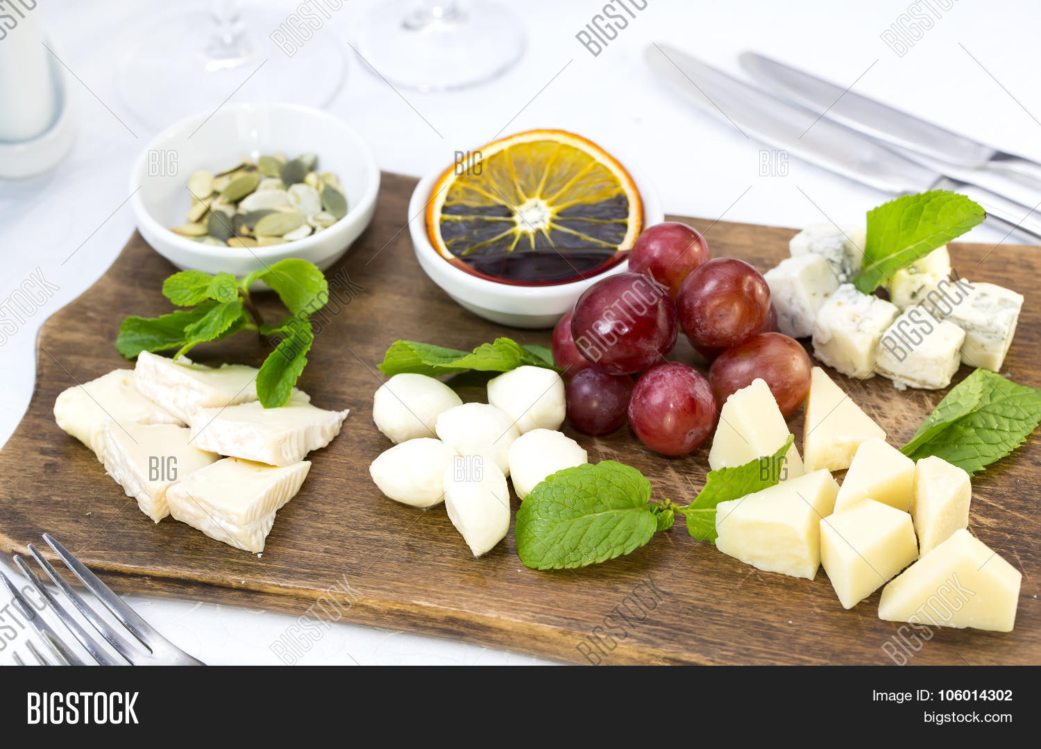 cheese plate with a large decorated the assortment of mint