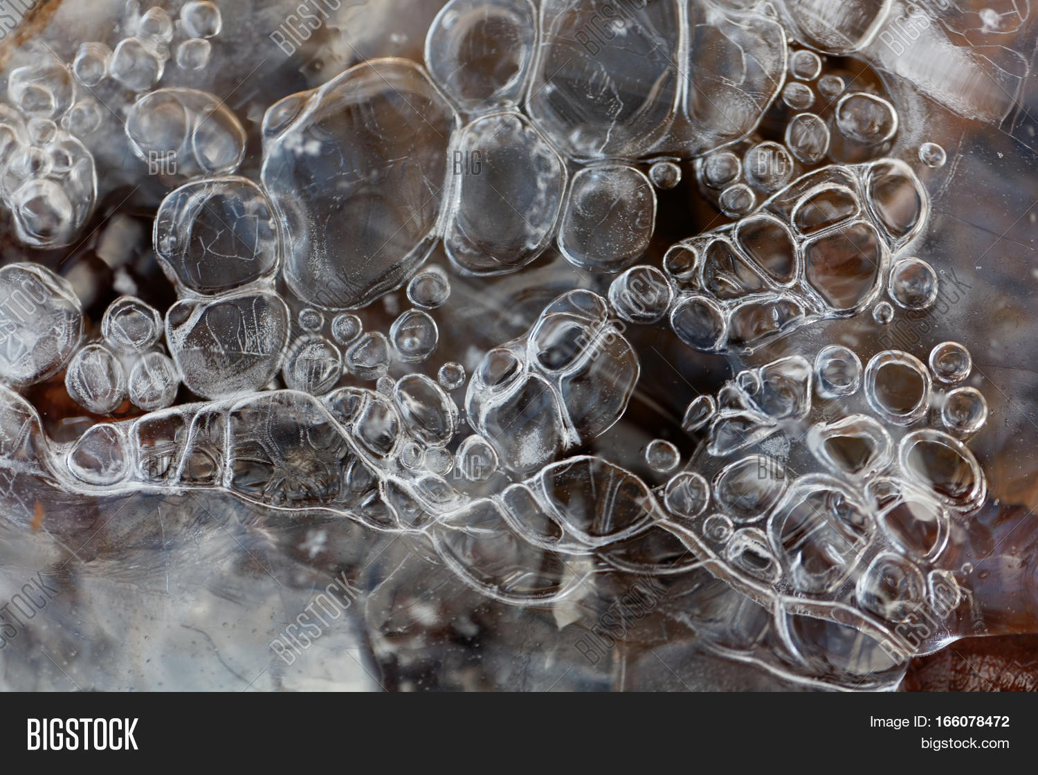 ice on a lake surface with air bubbles.