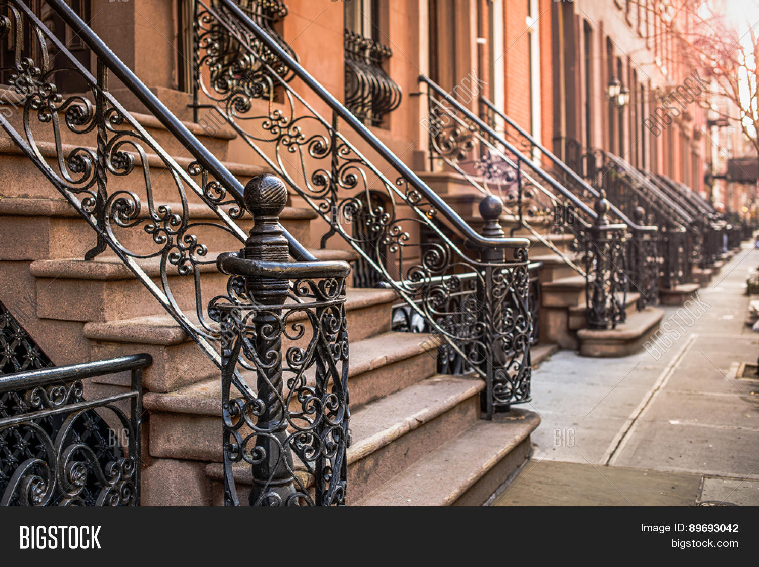 brownstone apartment building entrances in new york city.