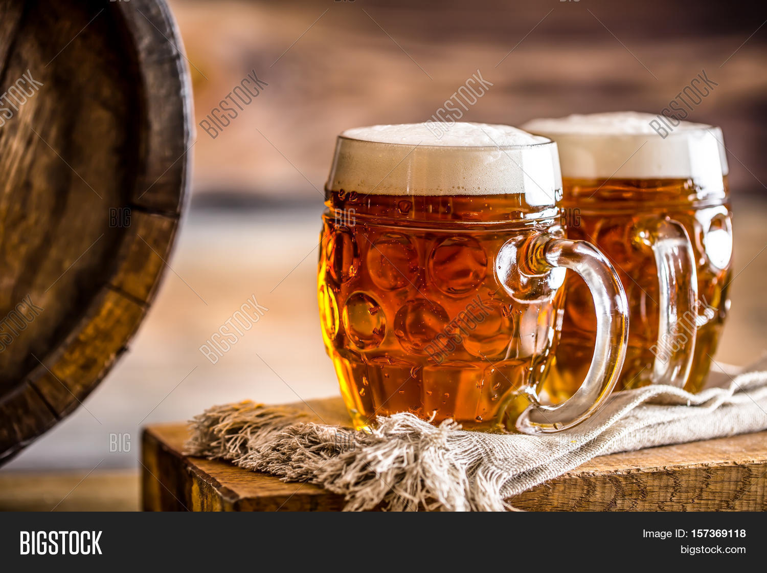 two cold beers. draft beer. draft ale. golden beer. golden ale.