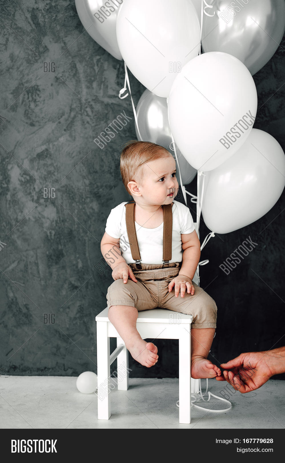 portrait of lovely little boy happy smiling celebrating 1 year