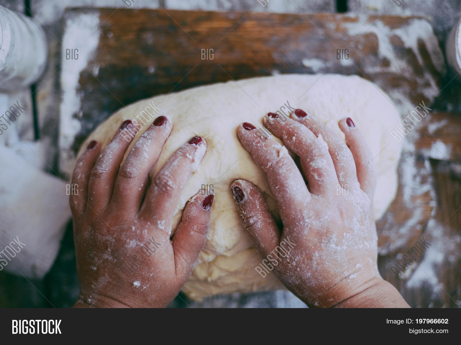 close view baker kneading dough.图片和照片 | bigstock