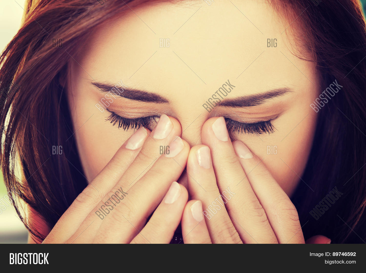 young woman with sinus pressure pain