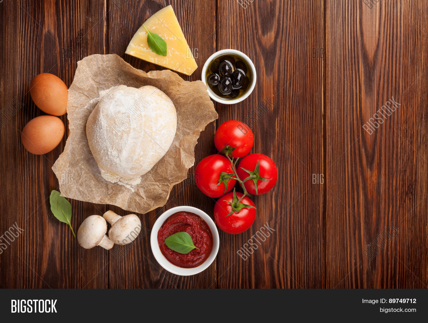 pizza cooking ingredients. dough, vegetables and spices.
