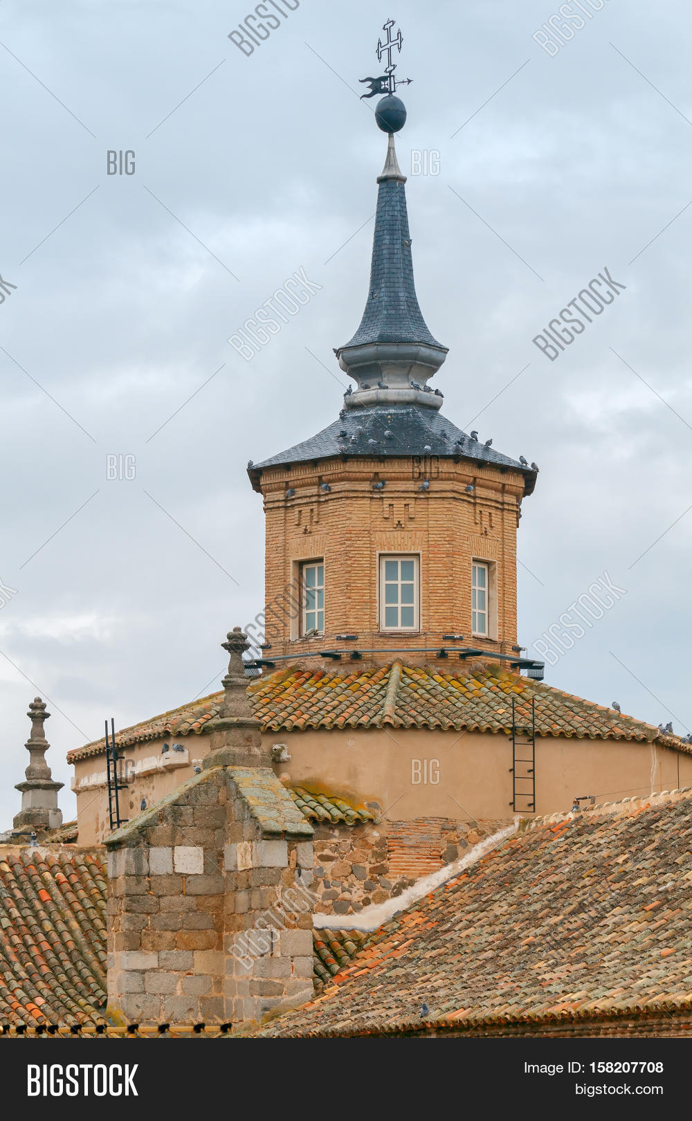 traditional tiled roofs on old houses in toledo. spain.