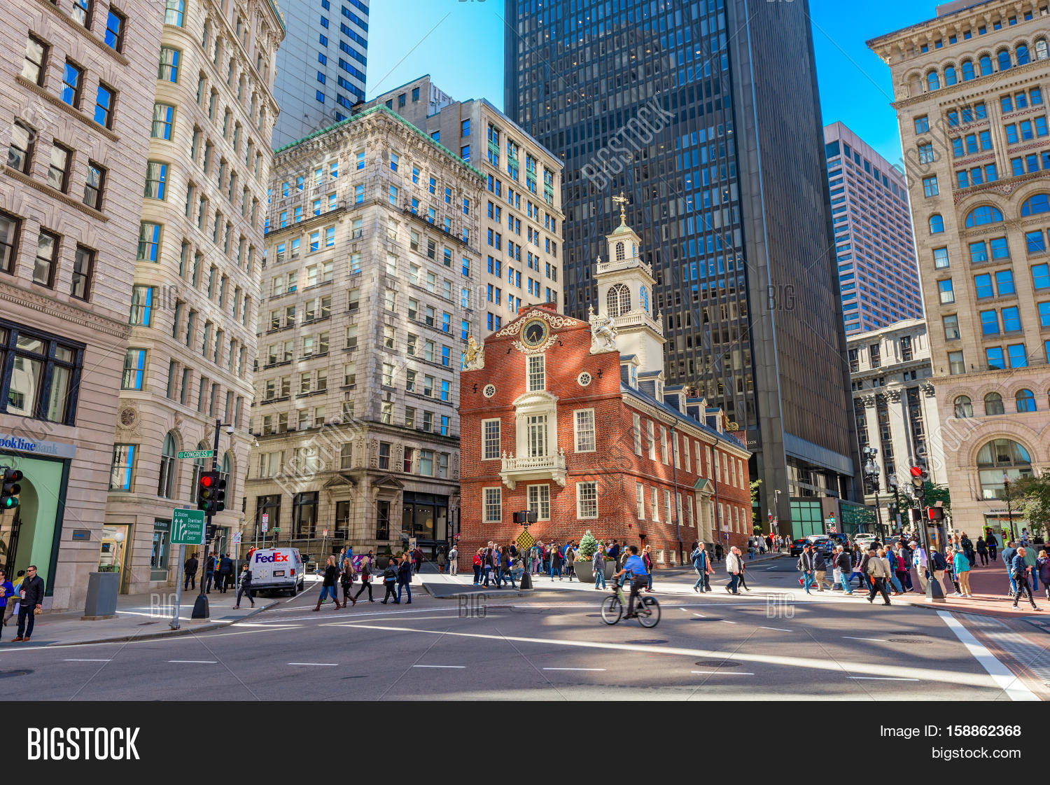 boston, massachusetts - october 14, 2016: pedestrians cross at