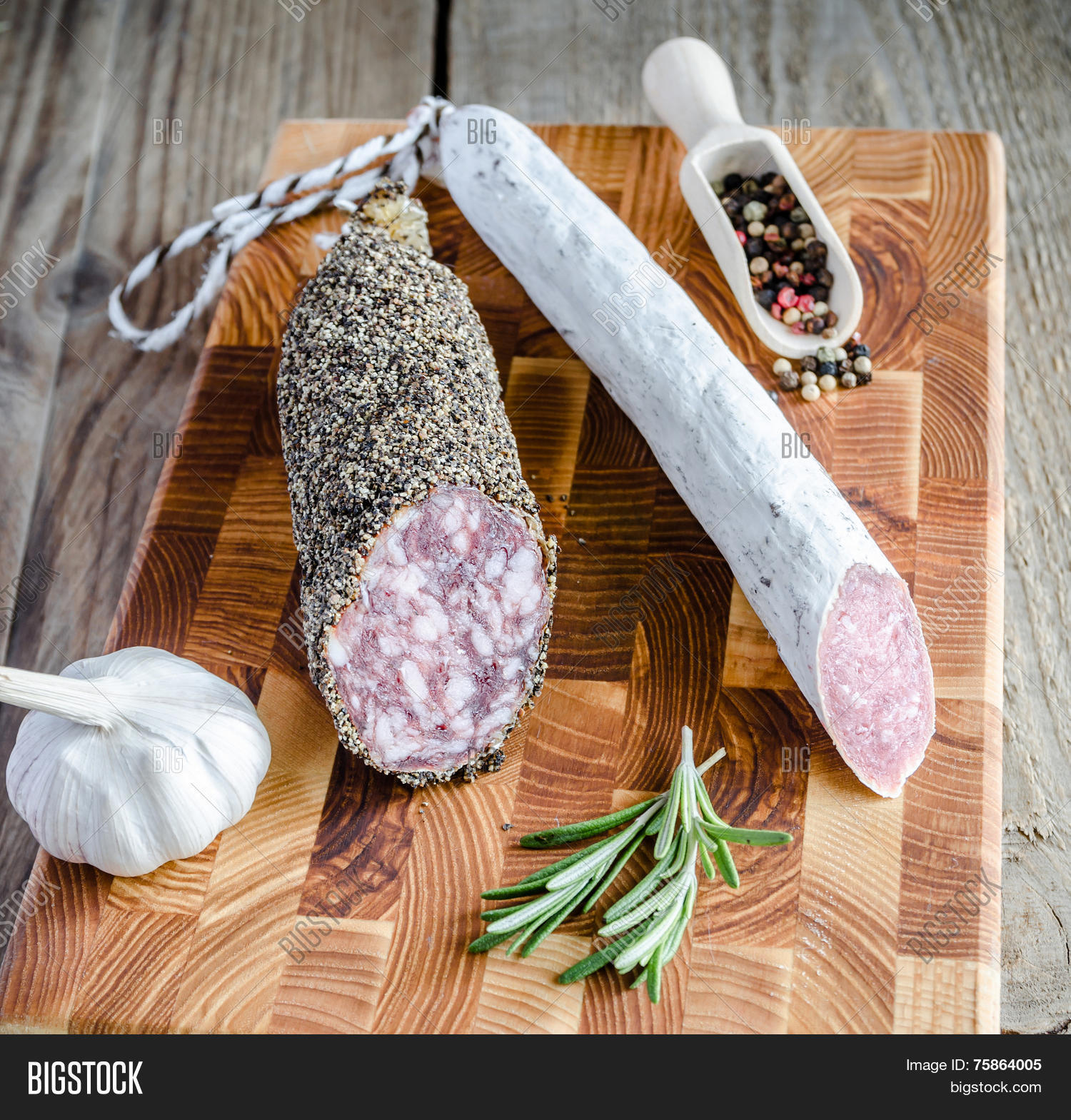 saucisson and spanish salami on the wooden board